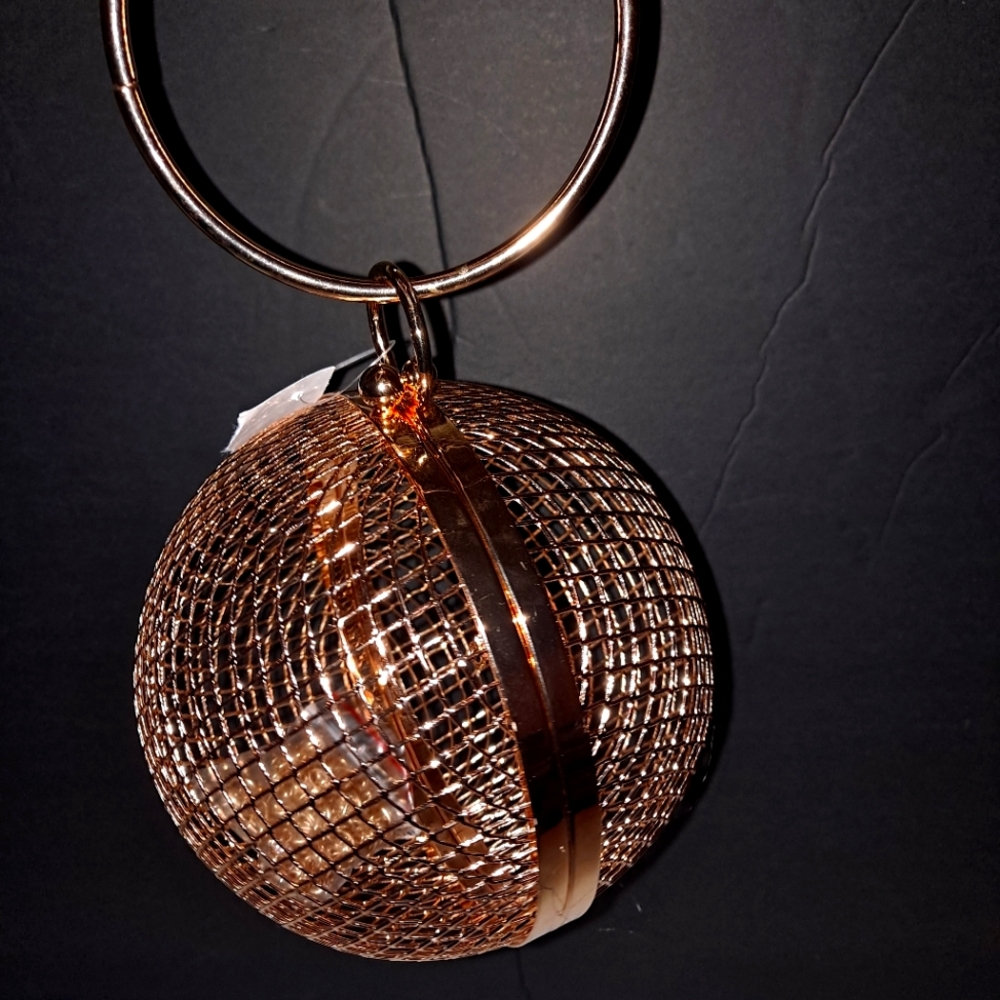 Gold ball clutch bag